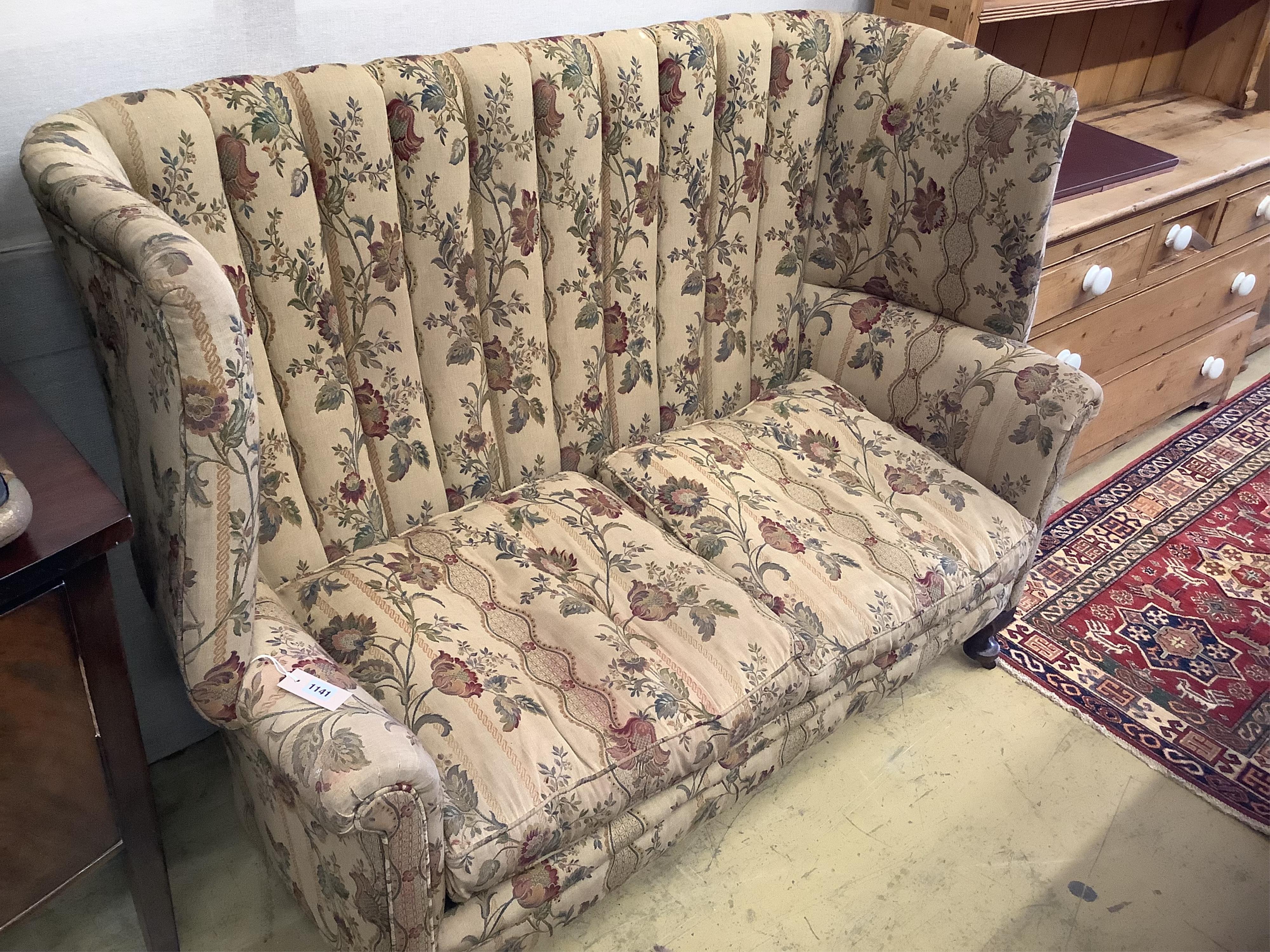 A barrel back upholstered 1920's two seat sofa, length 140cm, depth 70cm, height 110cm